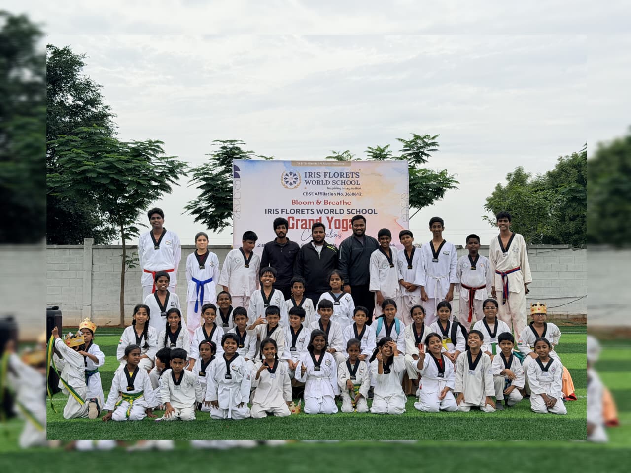 Ganghan Taekwondo students with their coaches at a school event